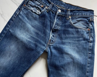 Petite 90’s Vintage distressed faded dark wash Levi 501 Jeans Waist 28 inch Leg 25 Inches Vintage levi Jeans Straight leg