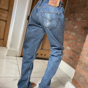 Waist 31 leg 32.5  90’s  501 Levi  Jeans Vintage  faded blue mid wash  levi Jeans Straight legs E39