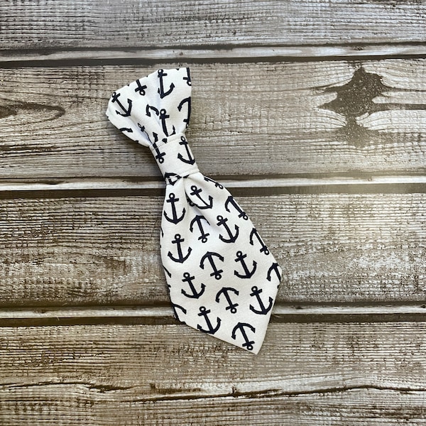 Black anchors on a white background cat or dog necktie, that slides on a collar.