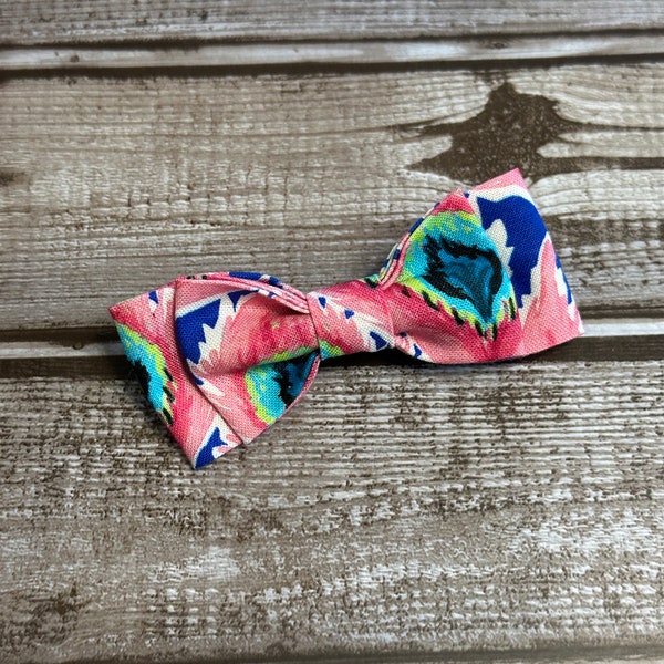 This stunning pink with blue and green peacock feather print is perfect for the fashion forward fur baby in your life!