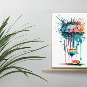 May include: A watercolor painting of a rainbow colored cocktail glass with a watermelon slice on the rim. An umbrella with blue, pink, and white stripes is above the glass. The background is white with colorful paint splatters.
