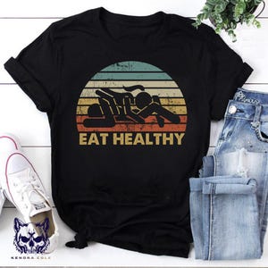 Eat Healthy Funny Retro Shirt | Adult Humor Graphic Tee | Sarcastic Vintage Style T‑Shirt | Naughty Gag Gift for Men & Women