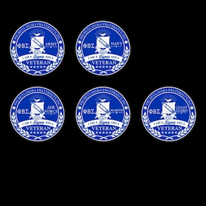 May include: Five circular blue and white emblems for Phi Beta Sigma Fraternity, Inc. Each features a central shield, the Greek letters ΦΒΣ, and the text I AM A SIGMA AND A VETERAN. The emblems specify Army, Navy, Air Force, Marine, and Coast Guard.