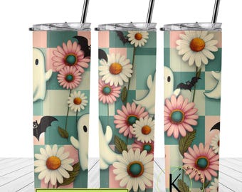 May include: A set of three stainless steel tumblers with a pink and teal checkered background. The tumblers feature a floral design with white daisies and pink flowers. There are also white ghosts and bats on the tumblers. The tumblers are 20 ounces each.
