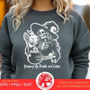May include: A gray sweatshirt with a white graphic of a skeleton witch stirring a cauldron with the text "Brewing Up Trouble and Coffee".