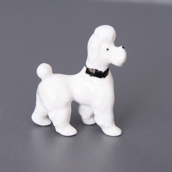 Vintage Porcelain Poodle Figurine. Small Collectible Knick-Knack. White Poodle With Black Bow Tie Collar
