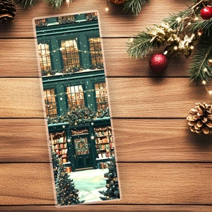 May include: A green building with a sign that says "Bookstore" and snow falling on the roof. The building is decorated with Christmas lights and a Christmas tree is in front of the building.