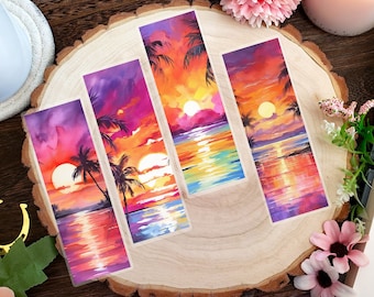 May include: Four rectangular bookmarks with sunset scenes. Each bookmark features a vibrant watercolor painting of a sunset over the ocean, with palm trees silhouetted against the sky. The colors include orange, yellow, purple, and red.