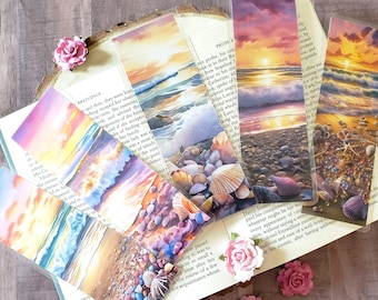 May include: Set of six colorful bookmarks featuring a beach scene with a sunset, waves, and seashells. The bookmarks are made of clear plastic and have a watercolor-like design.