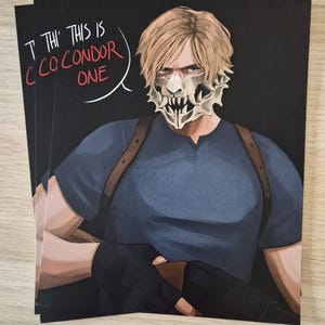 May include: A stack of black art prints featuring a character with blonde hair and a skull mask. The character is wearing a blue shirt and has the text "THIS IS CONDOR ONE" in a speech bubble.