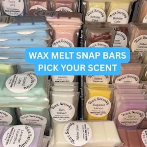 May include: A display of Wax Serenity wax melt snap bars in various scents, including Sugared Lemon, Berry Cheesecake, and Coconut Lime. The packaging is clear, showcasing the colorful wax bars. Text on the image reads "WAX MELT SNAP BARS PICK YOUR SCENT."