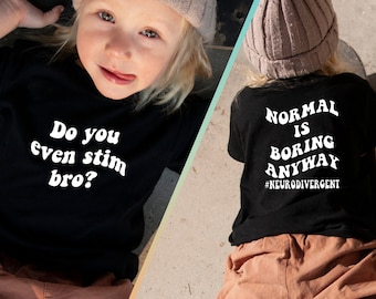 May include: A black t-shirt with white text that reads "Do you even stim bro?" on the front and "NORMAL IS BORING ANYWAY #NEURODIVERGENT" on the back. A young person is wearing the shirt and sitting on a skateboard.