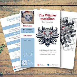 May include: Three sheets of paper with cross-stitch patterns on a wooden surface. The main sheet features a pixelated wolf medallion design with the text "The Witcher medallion". The pattern size is 2.07 x 1.79 inches.