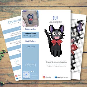 May include: Cross-stitch pattern featuring a black cat with a red bow tie, labeled "Jiji." The pattern size is 26 x 41 stitches, approximately 1.86 x 2.93 inches. Includes 12 DMC colors. The design is by elipsis box.