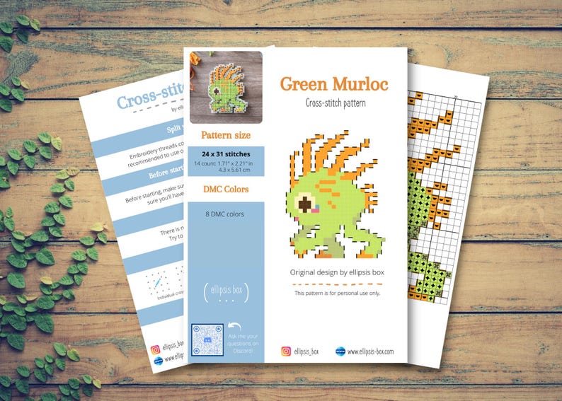 May include: Three sheets of paper on a wooden surface. The central sheet features a green pixelated Murloc cross-stitch pattern with orange accents. The pattern size is 1.71 x 2.21 inches (4.3 x 5.61 cm). The text reads "Green Murloc Cross-stitch pattern".