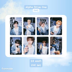 May include: A set of eight fanmade photo cards. Each card features a young man in a white t-shirt and light blue jacket. The cards have the text "Alpha Drive One" and "OMG". The set is labelled "SET 1".
