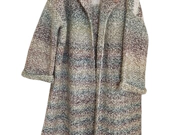 Woman's oversized warm handmade-knitted coat