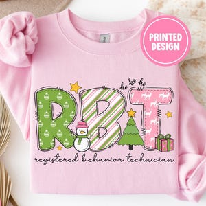 Rbt Pink Christmas Sweatshirt Gift, Behavior Technician Christmas Shirt, Girly Behavior Tech Xmas Sweater, Rbt Staff Tee