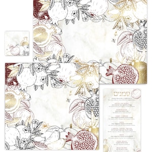 May include: A set of rectangular cards and a menu card featuring a decorative border of illustrated pomegranates, apples, and bees in shades of gold, deep red, and black line art on a light, marbled background. The menu includes the Hebrew title Simanim.