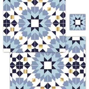 May include: A set of square tiles featuring a geometric pattern in navy blue, light blue, and white, accented with small metallic gold squares. The design consists of repeating star and diamond shapes arranged in a symmetrical, interlocking grid.