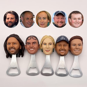 May include: Set of six bottle openers featuring different faces printed on them. Each opener is made of metal and has a silver finish.