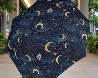 Paraguas Sol y Luna Celestiales: Estampado de galaxia, poliéster impermeable.