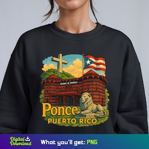 May include: Black sweatshirt with a vibrant graphic of Ponce, Puerto Rico. The design includes a building, a lion statue, a cross, and the Puerto Rican flag. The text "Ponce Puerto Rico" is displayed in a yellow font.