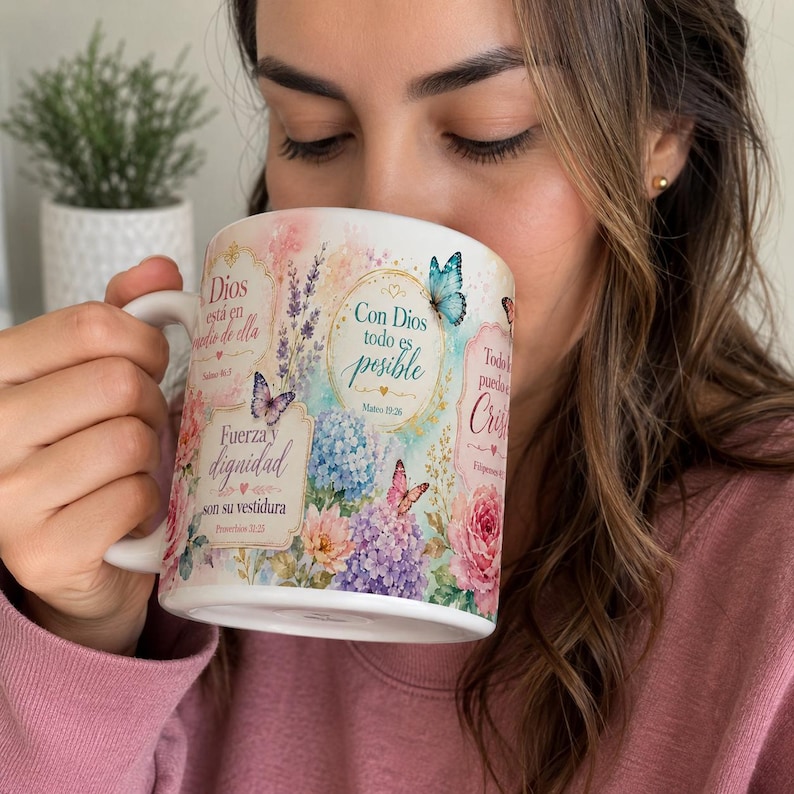 May include: White ceramic mug with floral and butterfly designs, featuring the text "Con Dios todo es posible" and other Spanish text. The mug has a curved handle and is filled with a beverage.