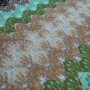 May include: A set of three ceramic mugs with a speckled, matte finish. Each mug features a different color: light blue, cream, and gray. The mugs have a simple, modern design and a comfortable handle.