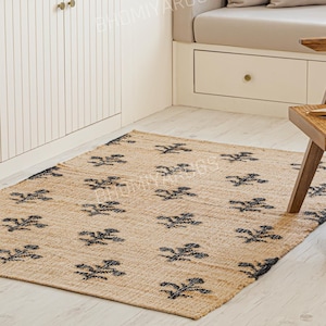 10 x 14 handgemaakt jute vloerkleed, zwarte bloemenaccenten, boho-decor