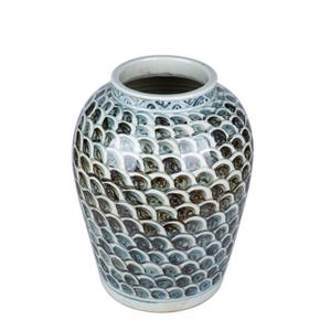 May include: A blue and white ceramic vase with a scale pattern. The vase is round and has a wide mouth.