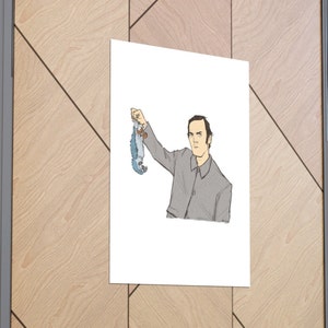 May include: A black and white illustration of a man holding a small blue bird by its feet. The man is wearing a gray jacket and has a serious expression on his face.