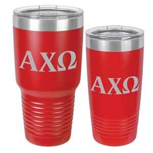 May include: Two red stainless steel tumblers with a silver lid. The tumblers have the letters AXQ engraved on them.