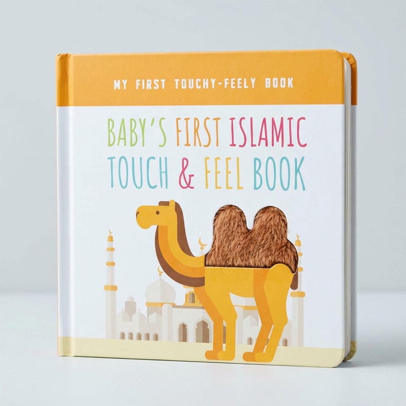 May include: A children's book titled "Baby's First Islamic Touch & Feel Book." The cover features a cartoon camel with a textured hump, set against a backdrop of a mosque and a yellow and white color scheme.