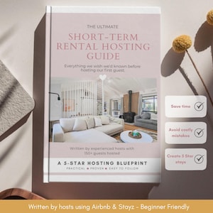 May include: A hardcover book titled The Ultimate Short-Term Rental Hosting Guide with a pale pink cover featuring a photograph of a living room. The text includes Everything we wish we'd known before hosting our first guest and A 5-Star Hosting Blueprint.