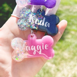 Personalized resin dog tag with specific shape, size, style and color. Add name and phone number with no extra cost when space allowed.