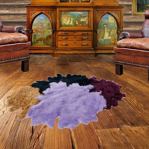 May include: Four faux fur rugs in different colors and shapes. The rugs are arranged in a semi-circle on a wooden floor. The rugs are purple, brown, green, and tan.