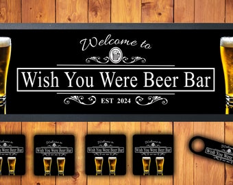 May include: A black sign with the text "Welcome to Wish You Were Beer Bar EST 2024" and two beer glasses. Includes four coasters and a bottle opener with matching text and beer glasses. The background is a wooden surface.