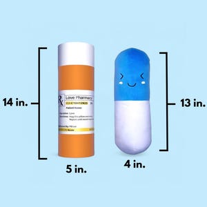 May include: A blue and white pill-shaped plush toy with a smiling face. The plush toy is 13 inches tall and 4 inches wide. Next to it is a 14-inch tall orange pill bottle with the text "Love Pharmacy RX C10H12N20 Dr" on the label. The bottle is 5 inches wide.