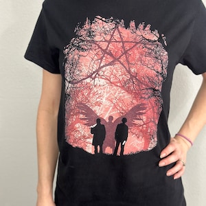 Haunted Forest Supernatural inspire t-shirt with Sam and dean Winchester faces and the road with quote Impala 1967 we are home black t shirt