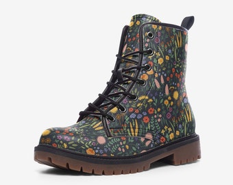 May include: A black combat boot with a colorful floral pattern. The boot features a lace-up design with black laces, a brown sole, and a pull tab at the back. The floral design includes yellow, orange, purple, and blue flowers.