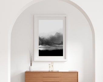 May include: A black and white abstract art print with a white frame. The print features a watercolor-like background with black lines.