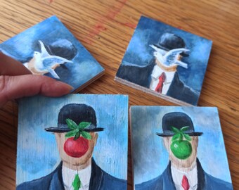 Set of 4 mini pictures a-la Rene Magritte, man with hat, green apple, gold sunrise, blue flowers, couple beards, vintage art decor on wood