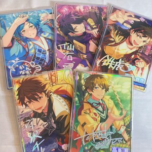 May include: Five colorful cards featuring anime-style characters with Japanese text. The cards are holographic and have a rainbow-like sheen. The characters are all male and are dressed in different outfits. The cards are all different sizes and shapes.