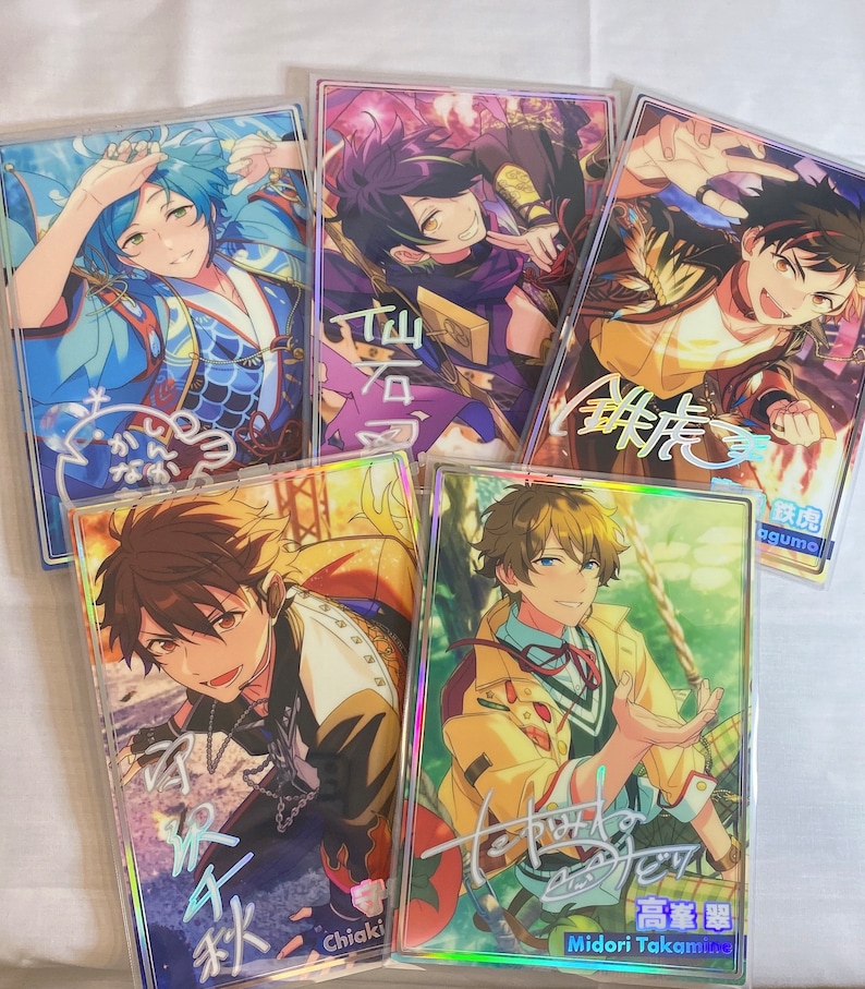 May include: Five colorful cards featuring anime-style characters with Japanese text. The cards are holographic and have a rainbow-like sheen. The characters are all male and are dressed in different outfits. The cards are all different sizes and shapes.