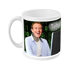 May include: White ceramic mug with a green and black digital pattern background. The mug features a photo of Mark Zuckerberg smiling and looking at a computer screen. The text "Tech" is printed on the mug.