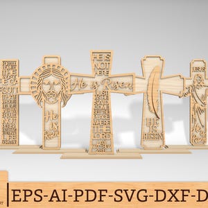 May include: Five wooden crosses with laser-cut designs and inspirational text. The crosses feature religious themes, including Jesus, a feather, and phrases like "He is Risen." The crosses are displayed on individual bases.