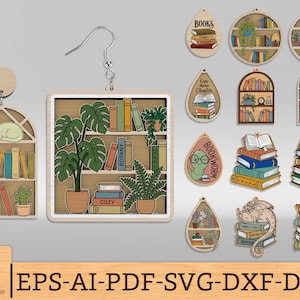 May include: Wooden earrings with a bookshelf theme. One earring features a cat sleeping on a shelf with books. Another earring has a square bookshelf with plants and books. Other earrings have book stacks and a dragon.