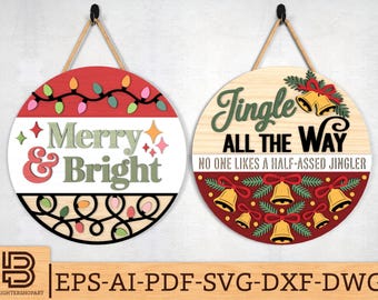 May include: Two round Christmas signs with rope hangers. One sign reads "Merry & Bright" with string lights. The other sign says "Jingle All The Way" with bells and the text "No one likes a half-assed jingler".