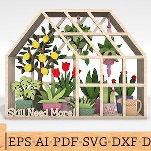 Puede incluir: Un expositor de madera con forma de invernadero que presenta recortes en capas de varias plantas en maceta, incluyendo un limonero, tulipanes rojos y cactus. El texto Still Need More está tallado en la base. Incluye plantas colgantes y una regadera.